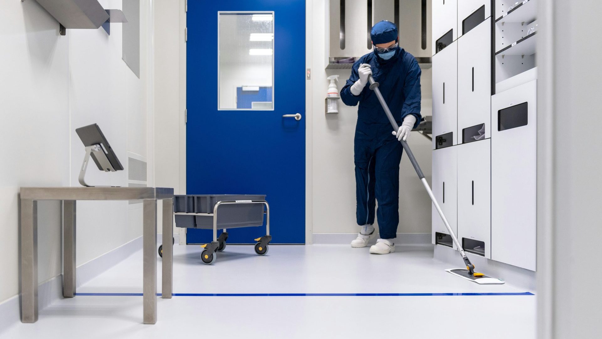 a person in a blue mask and a mask holding a ladder